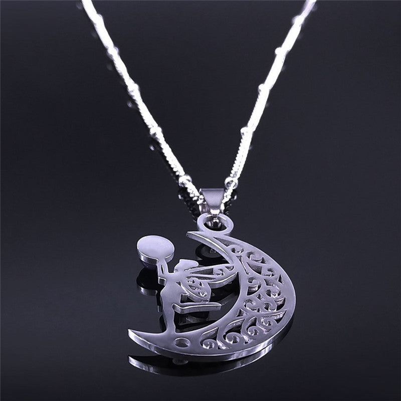 Rear view of the silver-tone crescent moon and fairy pendant necklace