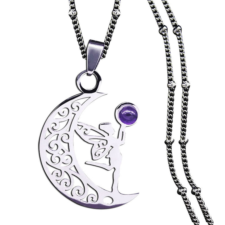 Silver-tone crescent moon and fairy pendant with purple accent on a white background