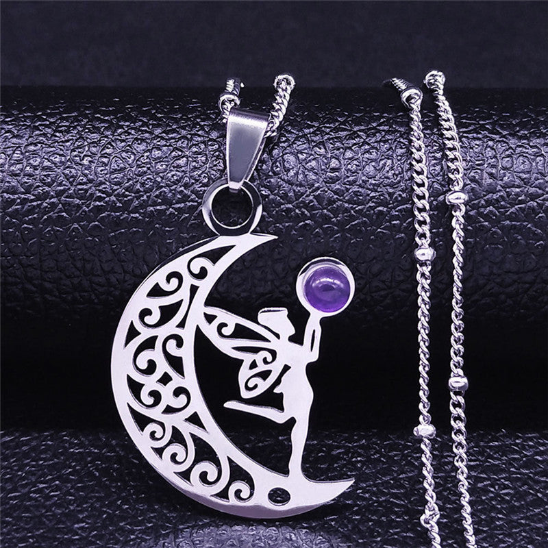 Silver-tone crescent moon and fairy pendant necklace with purple accent