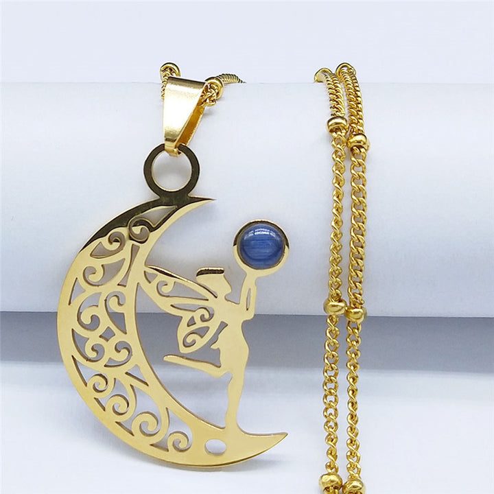Gold-tone crescent moon and fairy pendant necklace with blue accent