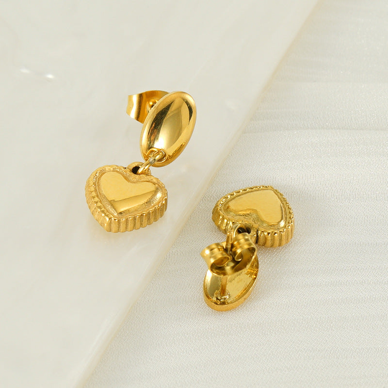 Heart drop earrings with hanging heart charms and oval post tops