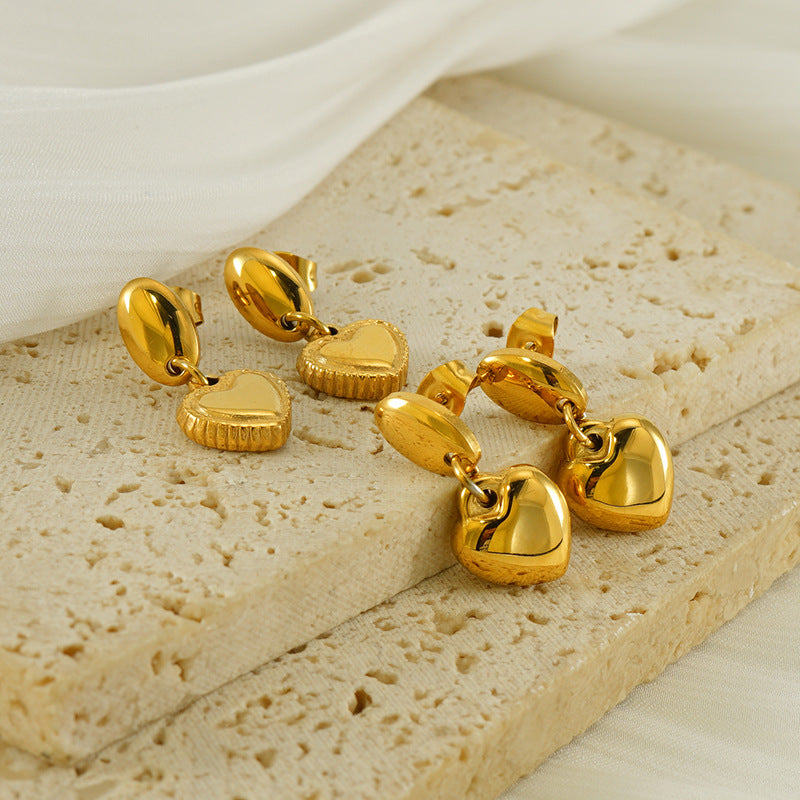 Heart drop earrings with hanging heart charms and oval post tops