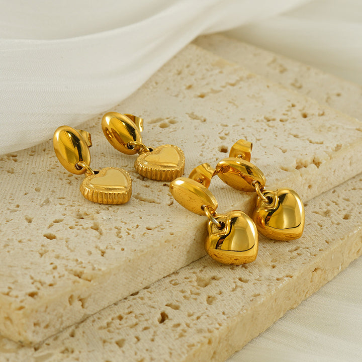 Heart drop earrings with hanging heart charms and oval post tops