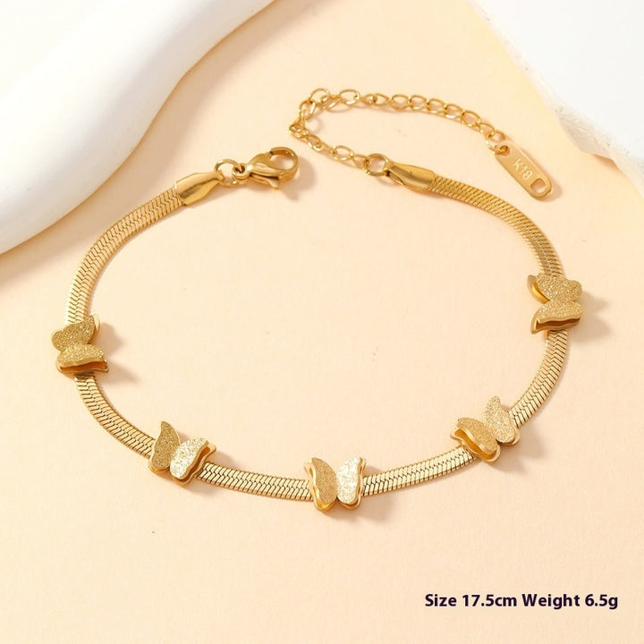 Gold-tone butterfly chain bracelet with repeating butterfly motifs