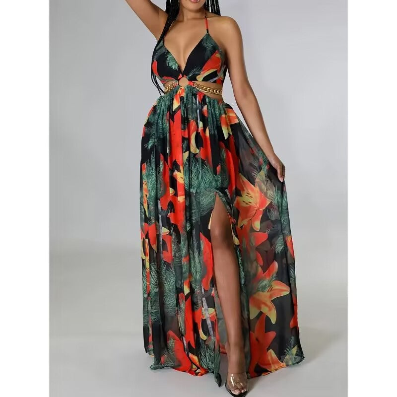 Black-ground red-and-orange floral halter maxi dress with green foliage, waist-chain detail and high slit. Supplier Color colourway.