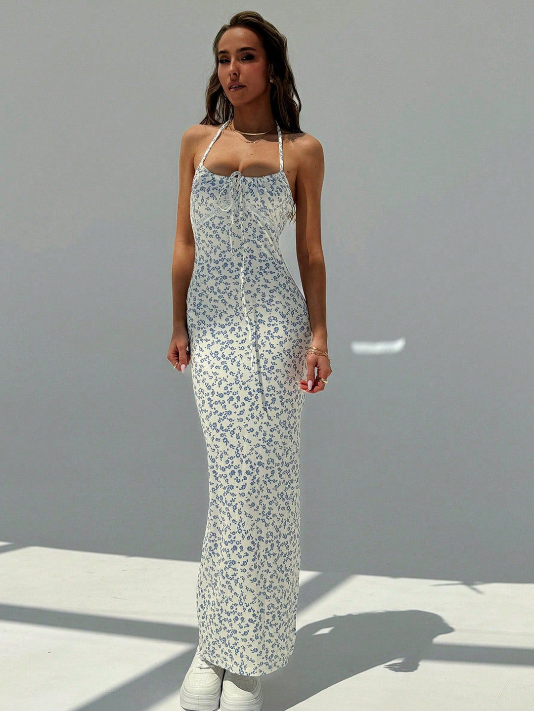 Blue floral tie-front slip maxi dress. Supplier product photograph.