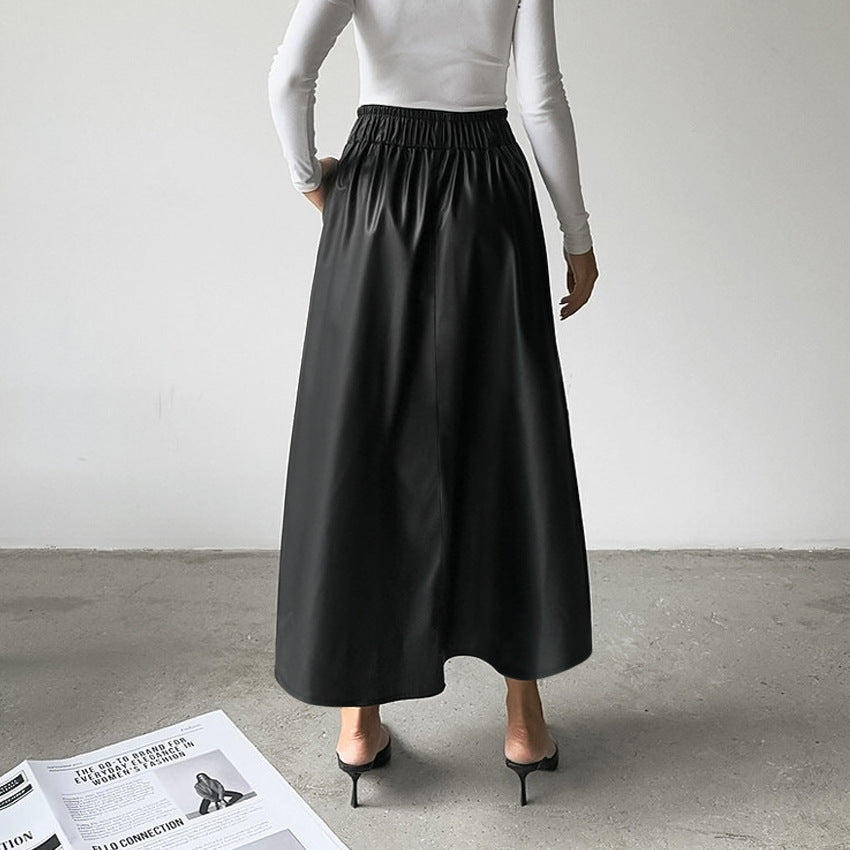 Black long A-line faux-leather skirt with a gathered elastic waistband.